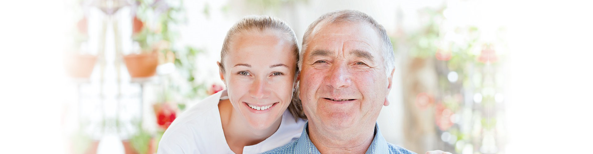 father and daughter smiling at the camera