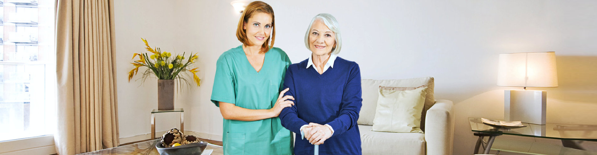 caregiver and her patient smiling for the camera